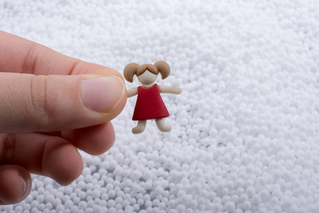 Little boys figurine and heart cubes on notebookの写真素材