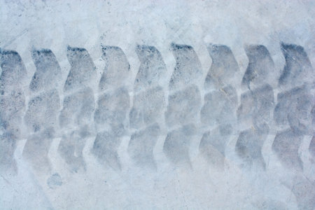 Tire tracks tire marks on Concrete  as abstract grunge texture