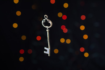 Retro style key on a bokeh light backgroundの写真素材