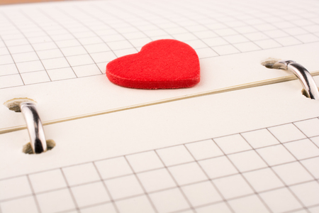 Heart on a checked notebookの写真素材