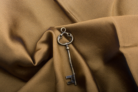 Retro styled color   decorativel key place on fabricの写真素材