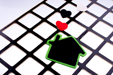 Green house on a grill with a few heartsの写真素材