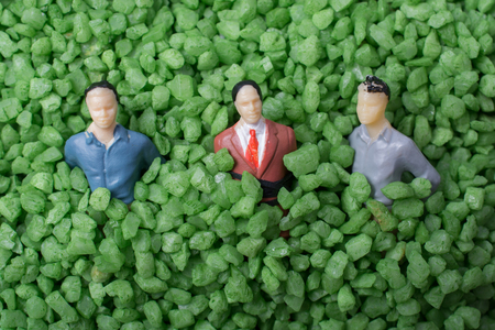 Group of tiny figurine of man in green sandの写真素材