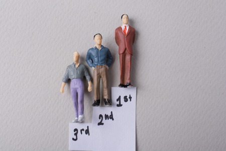 Tiny figurine of man miniature model in stagesの写真素材