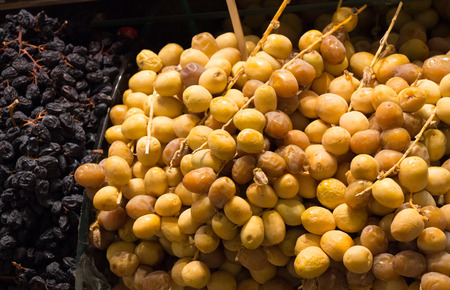 Heap of fresh dry dates at a market placeの写真素材