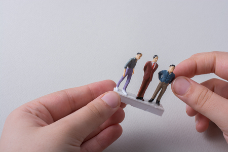 Tiny figurine of man miniature model in viewの写真素材