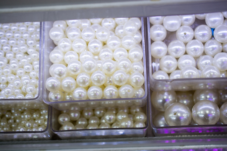 Pearl beads background with many shiny pearls in viewの写真素材