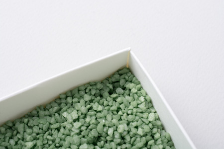 Little green color sand in box as a background textureの写真素材