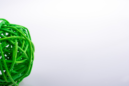 little green wooden ball on a white backgroundの写真素材