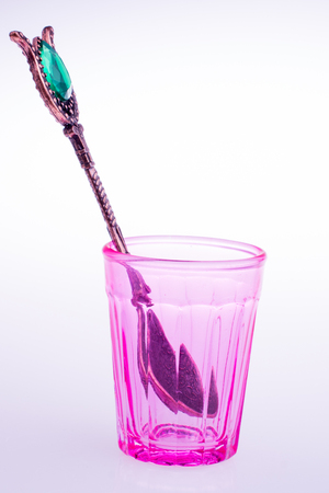 Drinking glass of red color with patternsの写真素材