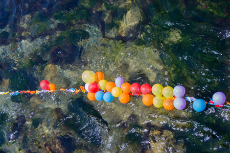 Balloons in shooting range as targets on water