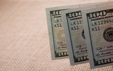Banknotes of US dollars on canvas on a linen canvas