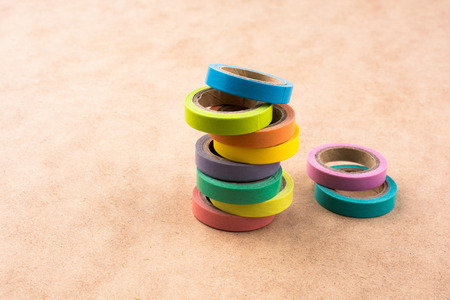 colorful insulating adhesive tapes on yellow backgroundの写真素材