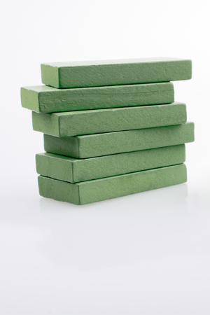 Colorful Domino Blocks in a line on a white backgroundの写真素材