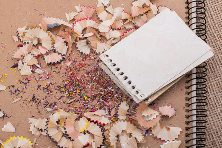 Spiral notebooks amid some colorful pencil trashの写真素材