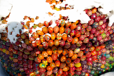 Easter eggs forming a shape on snowの写真素材