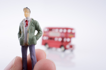 Human figure near a London Bus on a white backgroundの写真素材