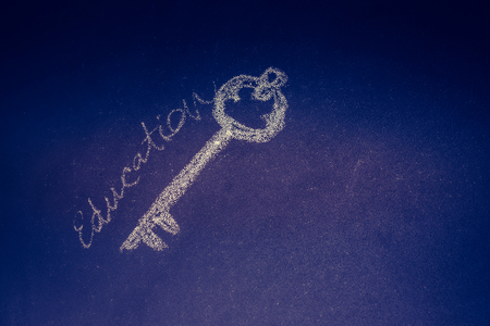 Retro styled golden color key forms the word keyの写真素材