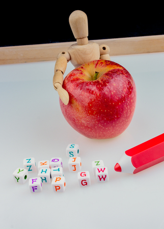 Back to school theme with a red appleの写真素材