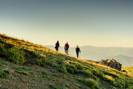 hikers with backpacks and trekking poles walking in Turkish highlandのeditorial素材