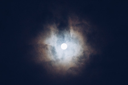 Grey color clouds partly cover the sky in the daytimeの写真素材