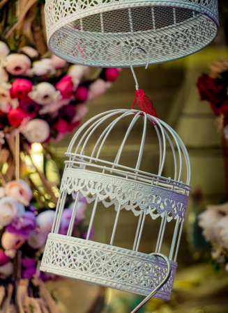 Little white bird house made of metalの写真素材