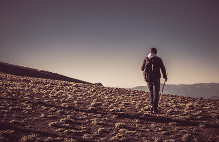hikers with backpacks and trekking poles walking in Turkish highlandの写真素材