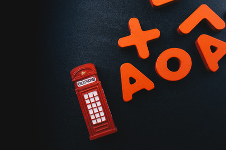 Telephone booth and colorful letters of Alphabet made of woodの写真素材