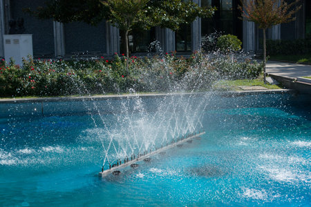 A water fountain sprinkling water in the viewの写真素材