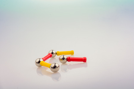 Magnet toy bars and magnetic balls on a white backgroundの写真素材