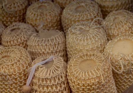 Collection of sea sponges hanging on a market stallの写真素材