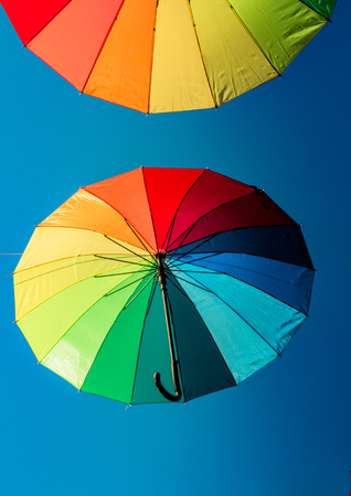 colorful umbrellas used in the sky street decorationの写真素材