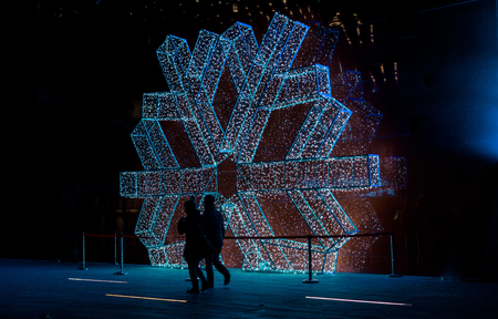 Large white snowflake model on a wall outdoorsのeditorial素材