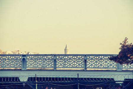 Part of decorative metal fence with Galata Tower behindの写真素材