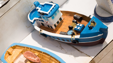 Mini size  little colorful model sailboat in viewの写真素材