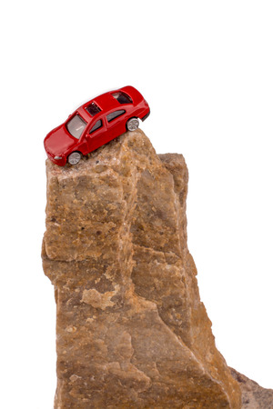 Little red model car on the top of a rockの写真素材