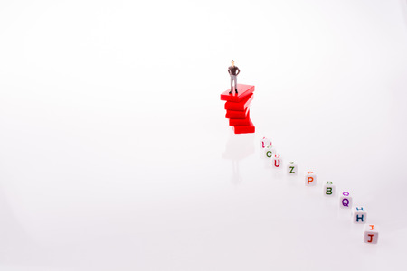 Man and alphabet blocks on a white backgroundの写真素材