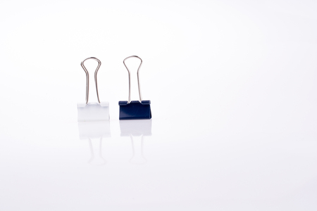 Colored paper clips on a white backgroundの写真素材