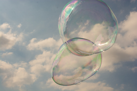 Blown soap bubbles float in air in viewの写真素材
