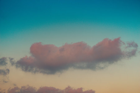 Grey color clouds partly cover the sky in the daytime