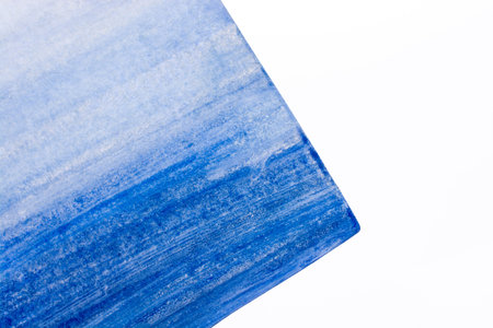 Torn note paper painted in blue on white