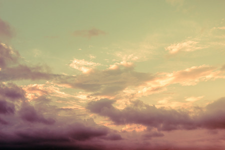 Grey color clouds partly cover the sky in the daytimeの写真素材