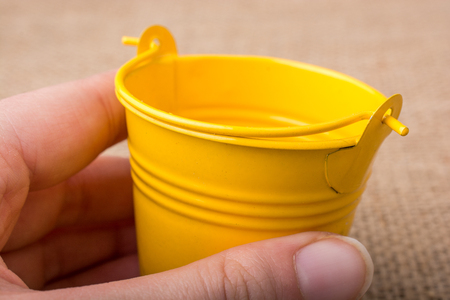 Old retro style metallic bucket in viewの写真素材