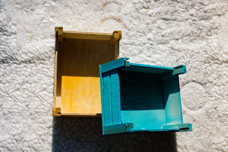 Colorful wooden empty crate boxes for sale in a market placeの写真素材