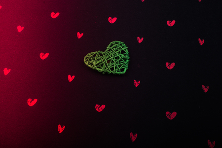 Handmade straw heart or valentines day object in handの写真素材