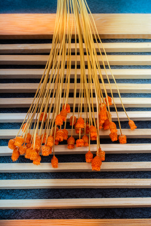 Bunch of dried flower placed on wooden backgroundの写真素材