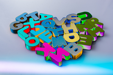 Colorful letter blocks shape heart on white backgroundの写真素材