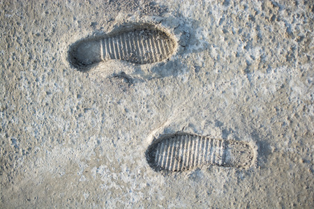 Footstep pattern seen on a concrete backgroundの写真素材