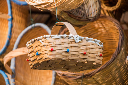 Empty wicker baskets are for sale in a market placeの写真素材