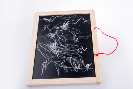Dirty blackboard on a white backgroundの写真素材